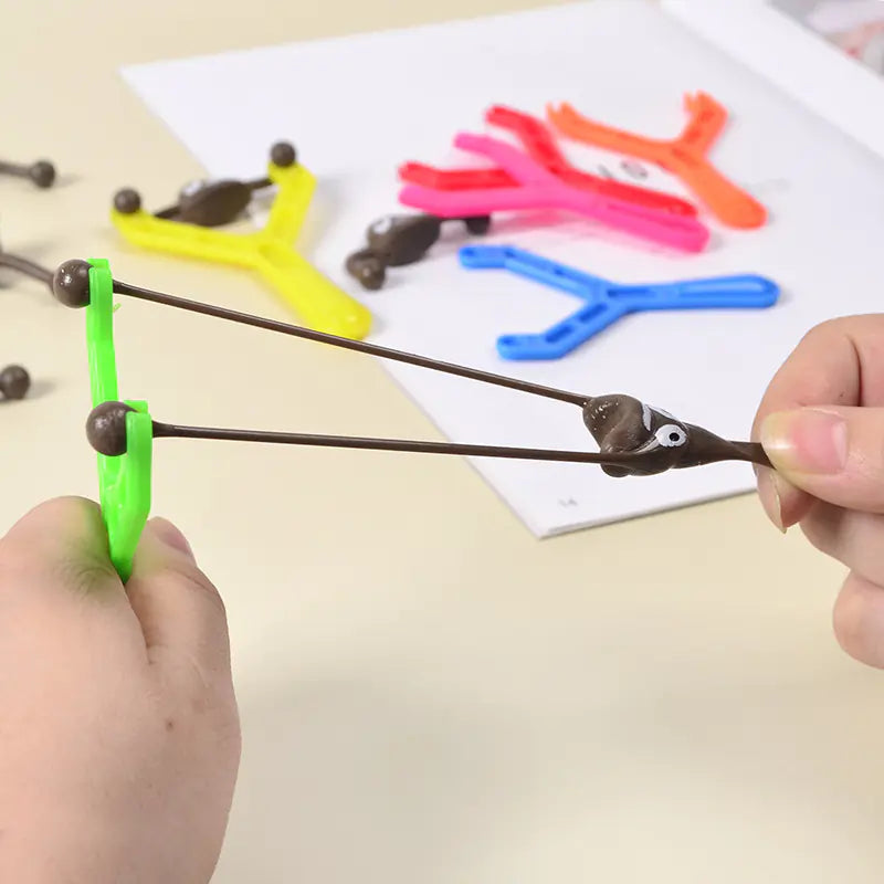 Funny Poop Slingshot Toy – Stretch & Launch Fun
